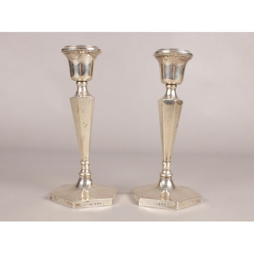 292 - A pair of silver hexagonal based candlesticks. Assayed in Birmingham 1919. Height: 21cm. Width: 10.5... 