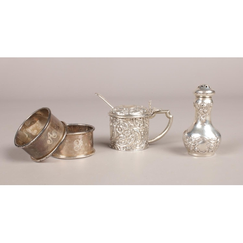 296 - Four items of silver. To include: Two Napkin Rings assayed in Birmingham 1919 by William Aitken, A M... 