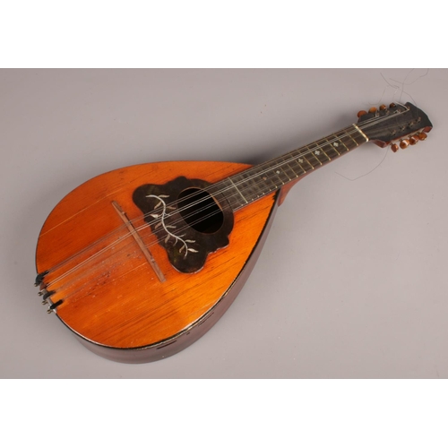 407 - A cased Rosewood 8 string mandolin, with mother of pearl inlay. 60cm x 23cm. (with additional string... 