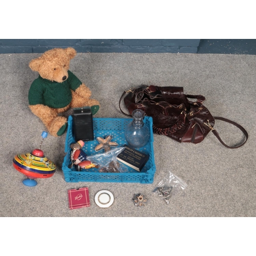 452 - A box of miscellaneous. Includes Italian Borsa Lino handbag, Harrods bear, vintage tinplate toys, Ge... 