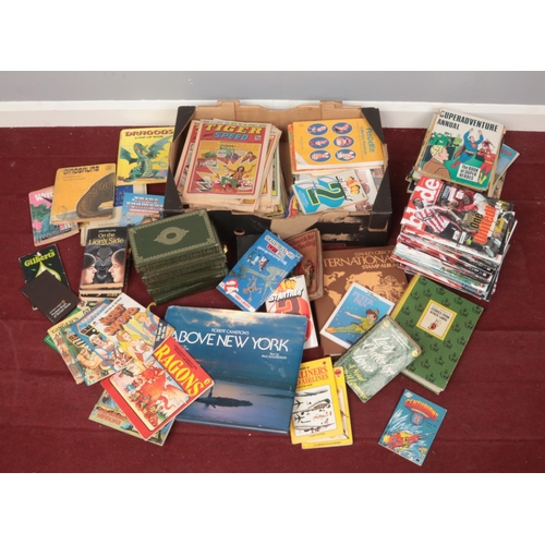 489 - A box and a bag of books and programmes. Includes Dickens, Ladybird books, Sheffield United programm... 