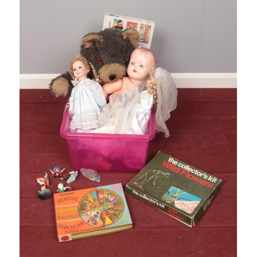 506 - A box of toys. Includes dolls, board games etc.