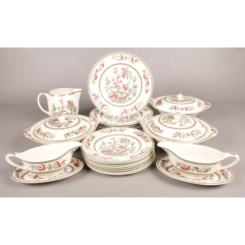 91 - A Johnson Bros dinner service in the Indian Tree pattern. Comprising of three lidded tureens, two gr... 