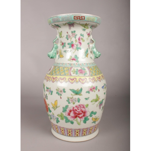 98 - A large Oriental Baluster Vase, the neck applied with temple dogs and floral decoration. 
Height: 35... 