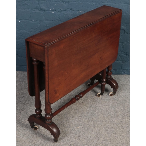 358 - A Victorian mahogany Sutherland table raised on turned support.