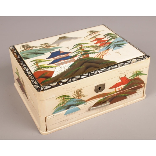 110 - An oriental style musical jewellery box with contents of costume jewellery beads.