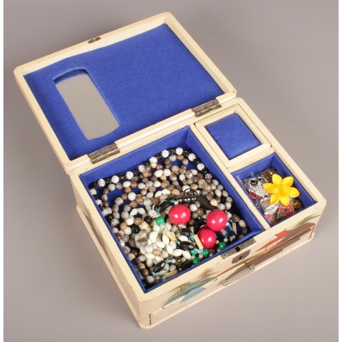 110 - An oriental style musical jewellery box with contents of costume jewellery beads.