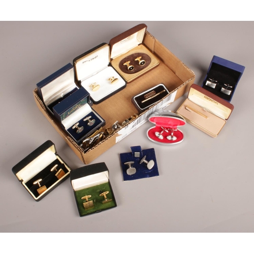 130 - A box of cuff links and studs. Including pair by Liberty, etc.