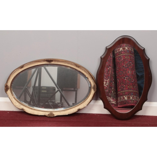 195 - Two framed wall mirrors - to include a gilt bevelled edged and Mahogany framed example. 
Largest: H:... 