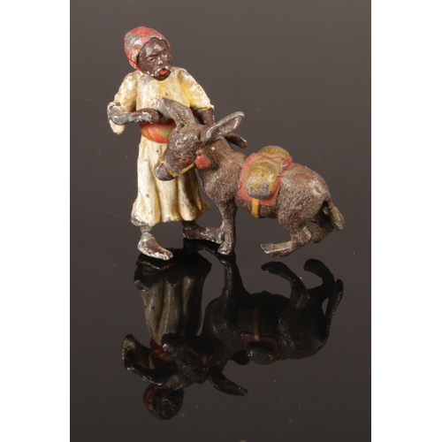 203 - A small cold painted bronze figure in the manner of Franz Bergman. Eastern man and donkey. 4.5cm tal... 