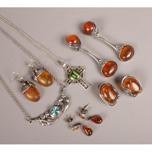 266 - A quantity of silver jewellery. Including amber set examples, etc.