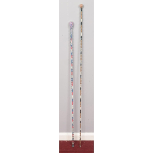 285 - Two Victorian twisted glass canes with multicoloured bead decoration.