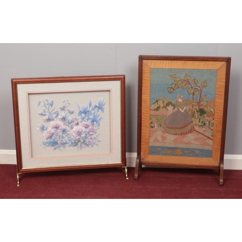 409 - Two decorative fire screens.  Comprising of an Oak framed tapestry of a crinoline lady and a floral ... 