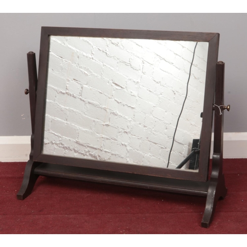 411 - A wooden pivot dressing table mirror. H: 52cm, W: 61cm.