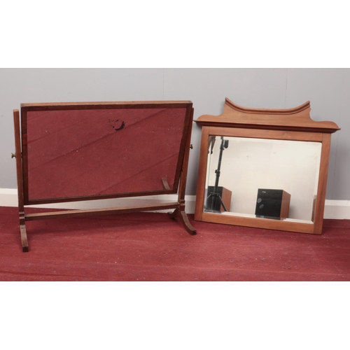 417 - A vintage wooden framed wall mirror and a dressing table mirror.