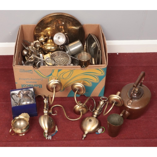 448 - A box of metalwares. Including silver plate trays, copper kettle, flatware, brassware, etc.