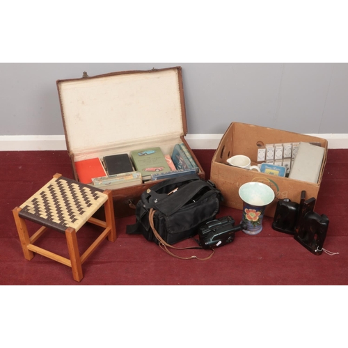 492 - A quantity of miscellaneous. Including bookends, books, camcorder, projector slides, etc.