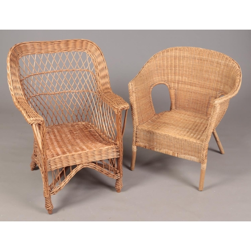 302 - Two wicker conservatory arm chairs.