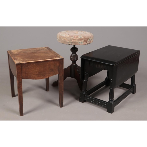 349 - Two wooden occasional tables together with a swivel stool. Comprising of an ebonised Oak twist top s... 