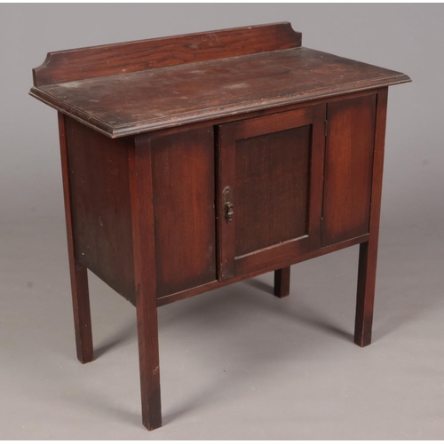 352 - An stained Oak dresser/cupboard with front door. H: 87cm, W:84cm, D:43.5cm.