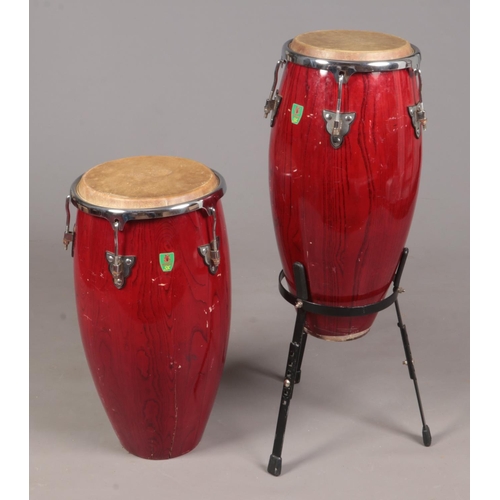 401 - Two large wooden Percussion SX bongos, one with metal stand.