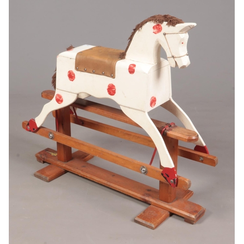 412 - A vintage Leeway wooden rocking horse.