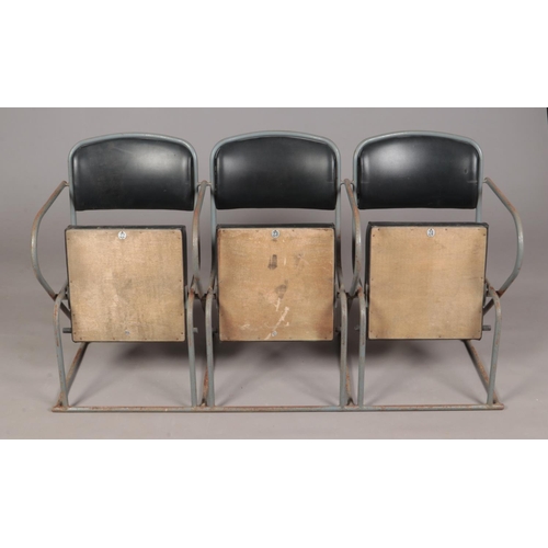 414 - A set of three cinema seats with tubular steel frame.