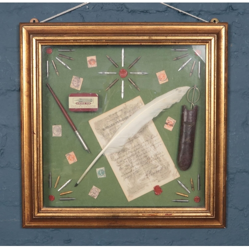 261 - A gilt framed diorama. With contents of Richard Prescott & Co letter, writing instruments, stamps et... 