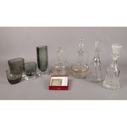 66 - A selection of assorted glassware. To include a Swedish Orrefors vase no 3595/2, four glass decanter... 