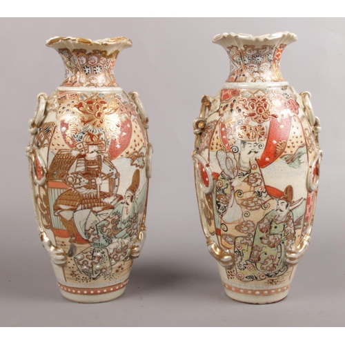 69 - A pair of Satsuma style vases, depicting warriors decorated with twin-rope twist handles. Makers mar... 