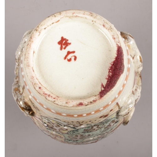 69 - A pair of Satsuma style vases, depicting warriors decorated with twin-rope twist handles. Makers mar... 