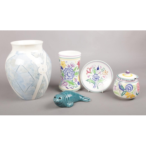 87 - Five pieces of assorted Poole Pottery. To Include a 'Bellini' hand-painted vase, a ceramic seal and ... 
