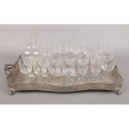 93 - A butler tray along with an etched small glass decanter and twenty etched Greek key pattern liquor g... 