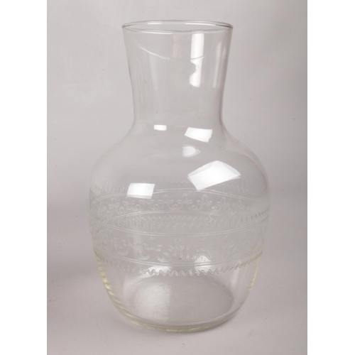 93 - A butler tray along with an etched small glass decanter and twenty etched Greek key pattern liquor g... 