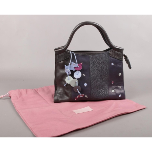 96 - A Black Radley handbag. (with dust cover)