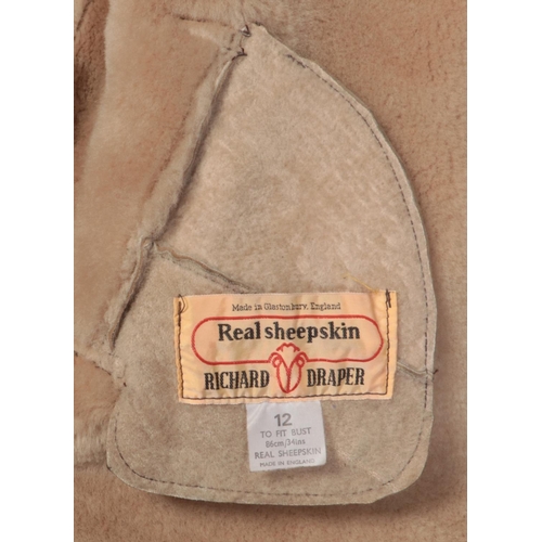 495 - Three sheepskin coats. To include a Richard Draper light brown with brown piping Size 12 - a George ... 