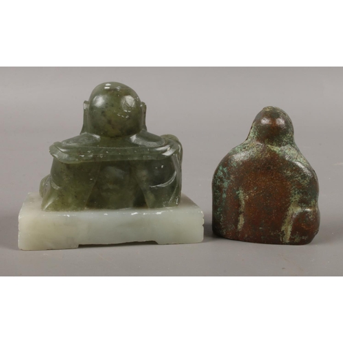 398 - Two small seated Buddhas. Comprising of one Buddha in bronze and the other in spinach Jade on plinth... 