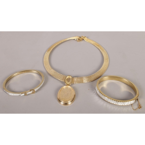 374 - A Henkel and Grosse (Dior) 1970s pendant on chain along with two paste set Michael Kors bangles.