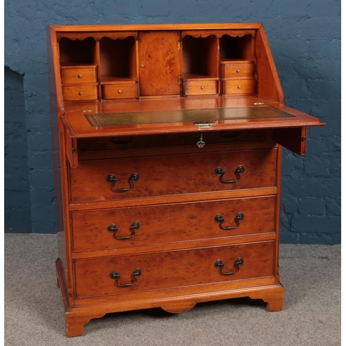 469 - A modern yew wood bureau with fitted interior. (100cm height 73.5cm width 46cm depth)