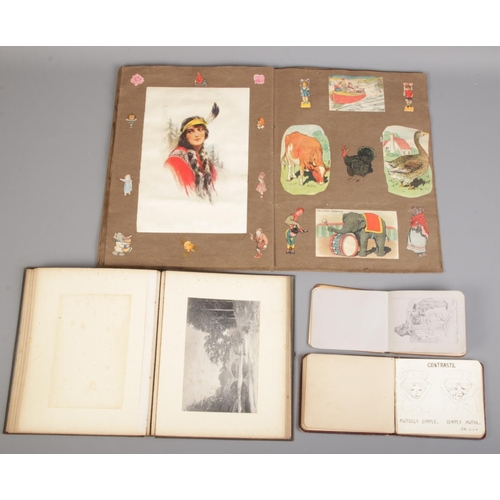 125 - A quantity of albums and contents. Including illustration by F.G Walker, sketches, messages, etc.