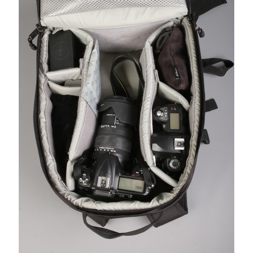 148 - A large quantity of photographic equipment, including Nikon D300 with Sigma 18-125mm lens, Nikon D70... 