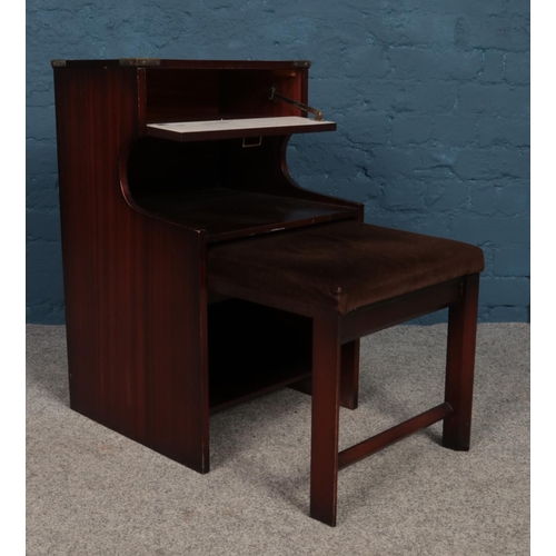 245 - A 'Chippy' mahogany telephone table and seat. H: 71cm, W:43cm  D:42cm.