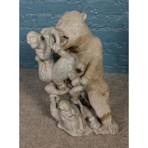 279 - M Takayo. A Carved Soapstone figure group, bear fighting with male figures. Signed to the base H: 53... 