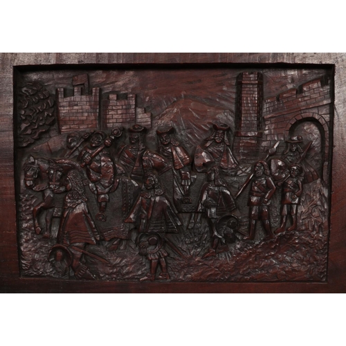 315 - Two wooden wall carvings. To include a large Mahogany carved plaque of King Charles I leaving Kingst... 