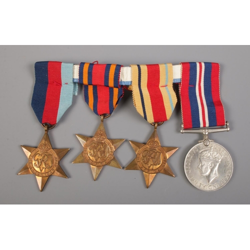 332 - A boxed set of four WW2 medals. Comprising of 1939-45 star, Burma Star, Africa Star and War Medal 19... 