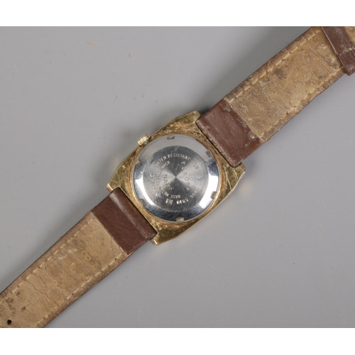 334 - A Gent's Seiko 5 automatic wristwatch, with 17 jewel movement, day and date markers and on brown str... 