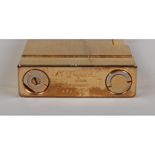 335 - An ST Dupont of Paris gold plated cigarette lighter.