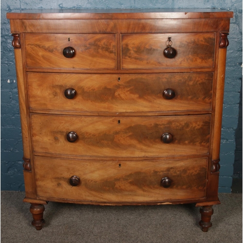 418 - A large Victorian carved mahogany bow front chest of two over three drawers. (128cm x 113cm x 56cm)