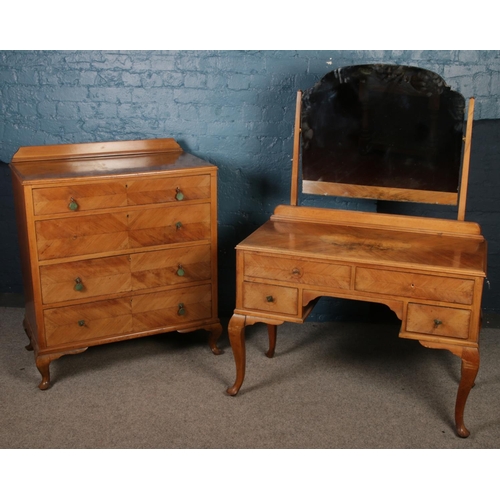 429 - A walnut three piece bedroom suite. Comprising of mirror front wardrobe, dressing table and chest of... 