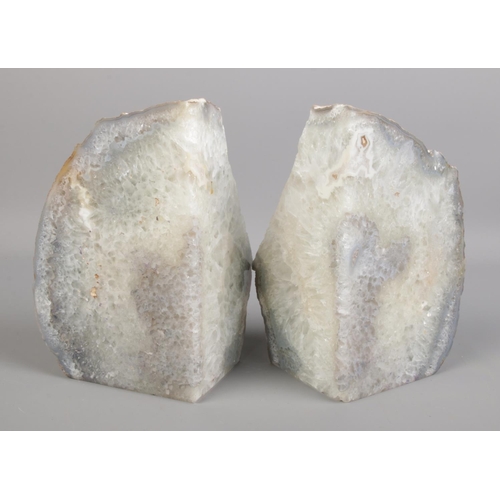 126 - A pair of grey quartz book ends. H: 20cm W: 12.5cm.